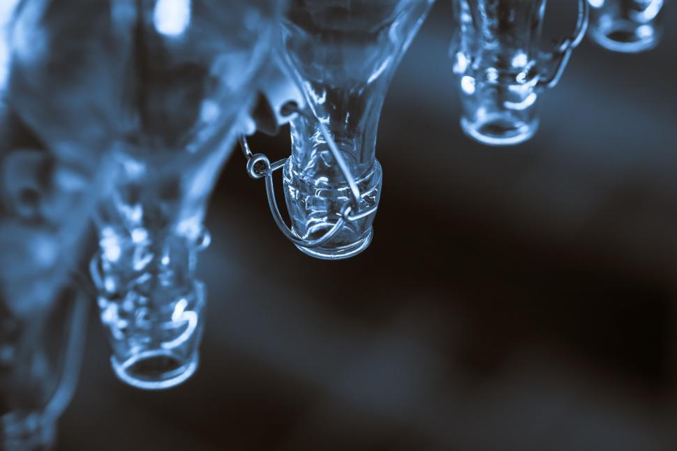 Free Image of Group of Glass Vases Hanging From Ceiling 
