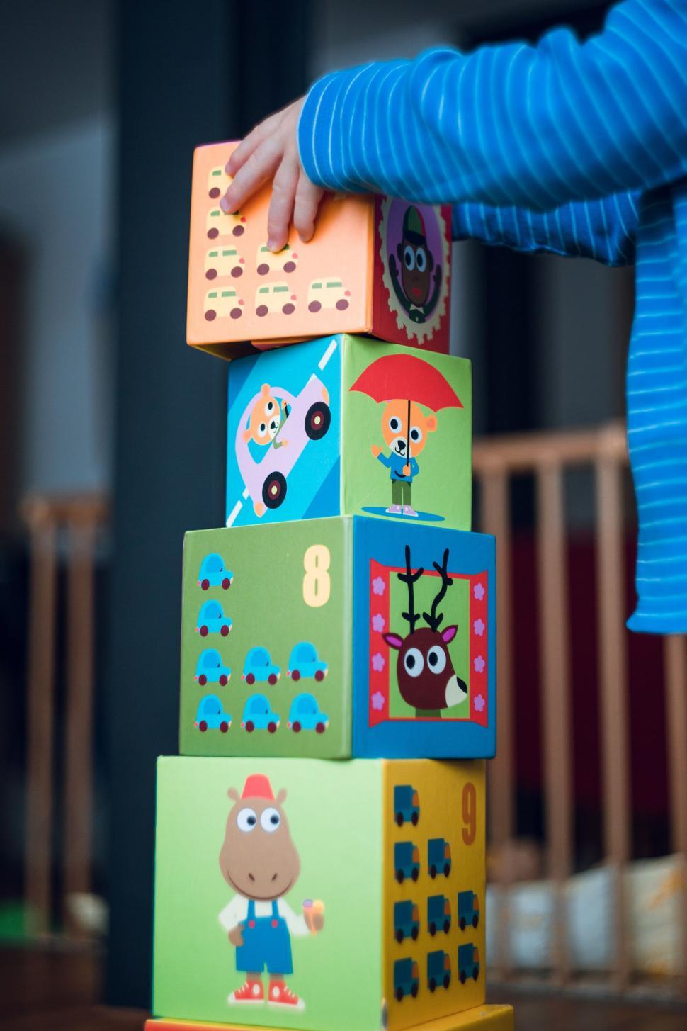Free Image of Child Playing With Tower of Blocks 