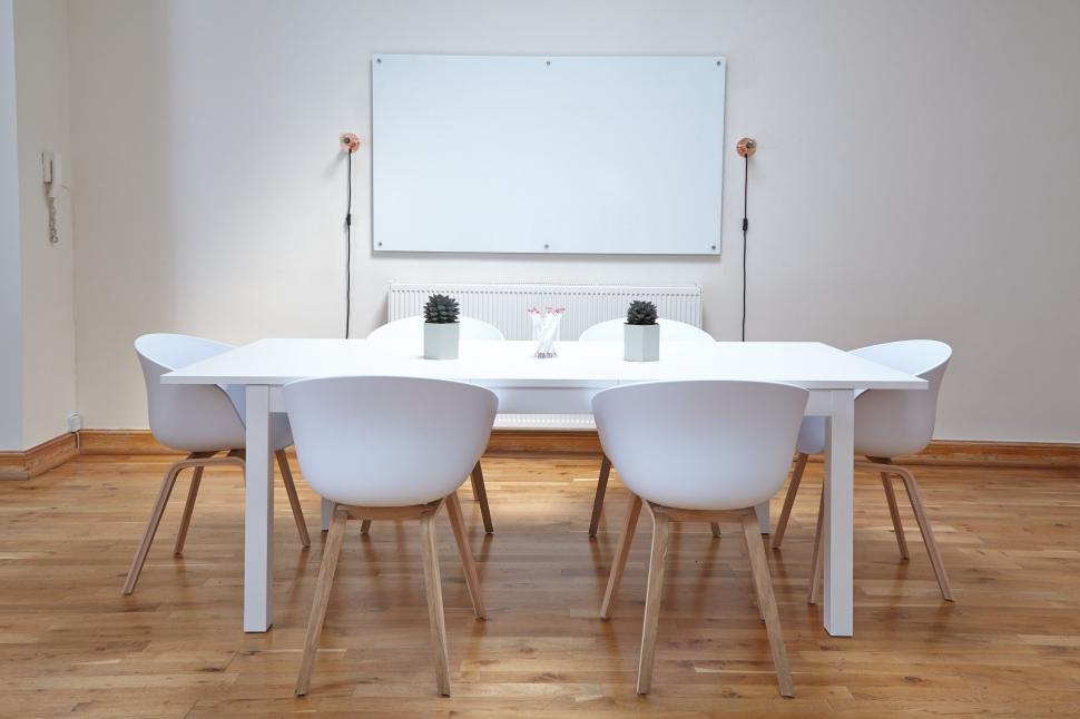 Free Image of White Table and Chairs in Room 