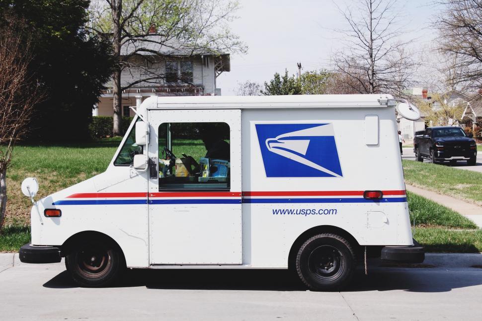Free Image of Postal Truck Parked on Side of Road 