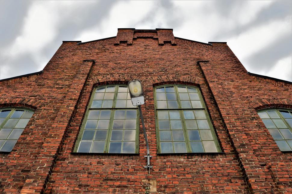 Free Image of Red Brick Building With Three Windows and a Clock 
