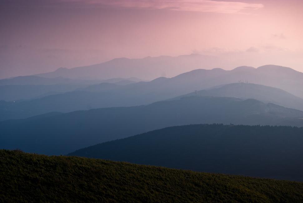 Free Image of Majestic Mountain Range Under a Pink Sky 