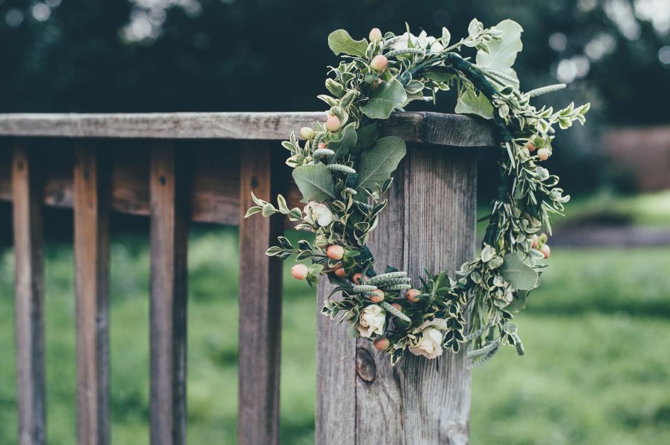 Free Image of Wreath Hanging on a Wooden Post 
