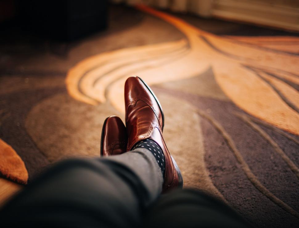 Free Image of Mans Feet in Suit and Tie on Carpet 