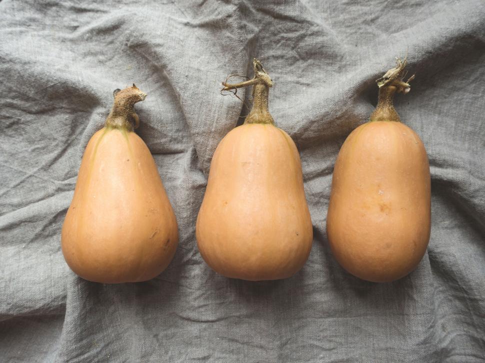 Free Image of Three Gourds on Gray Cloth 