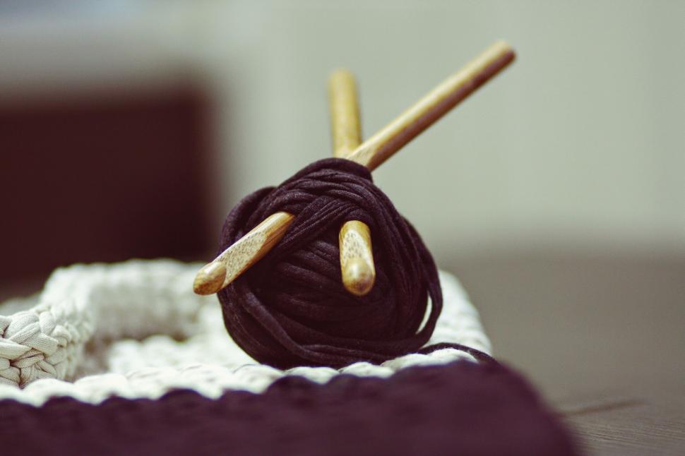 Free Image of Close Up of a Ball of Yarn and Two Knitting Needles 