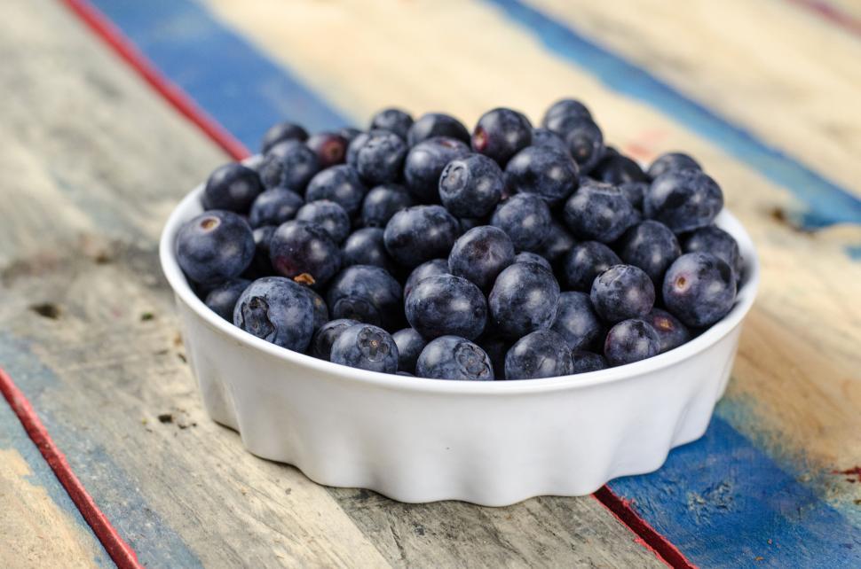 Free Image of White Bowl Filled With Blueberries on Wooden Table 