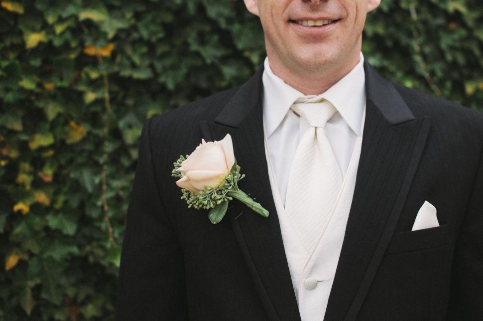Free Image of Elegant Man in Tuxedo With Flower in Lapel 