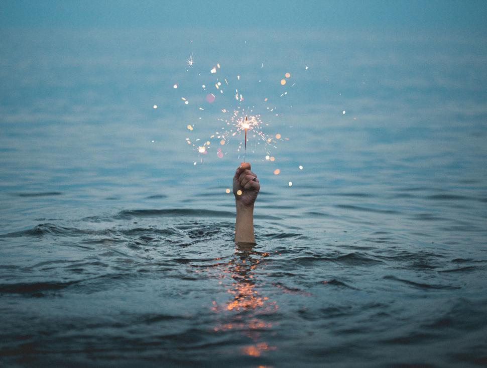 Free Image of Sparkler Held in Water 