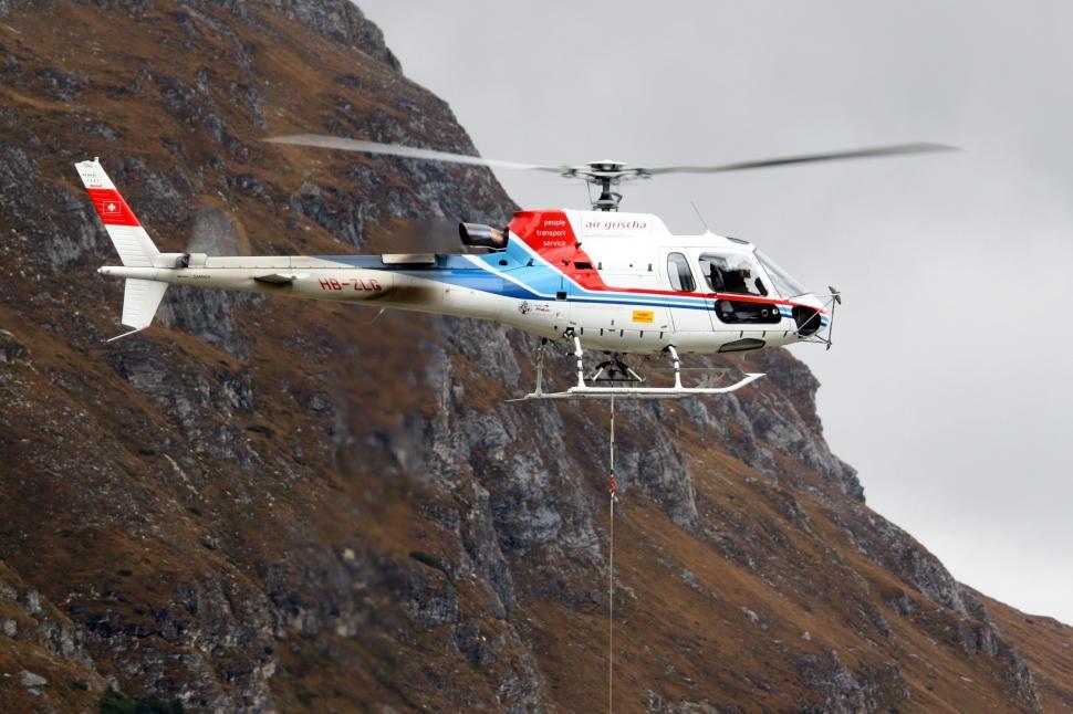 Free Image of Helicopter Flying Over Mountain Side 