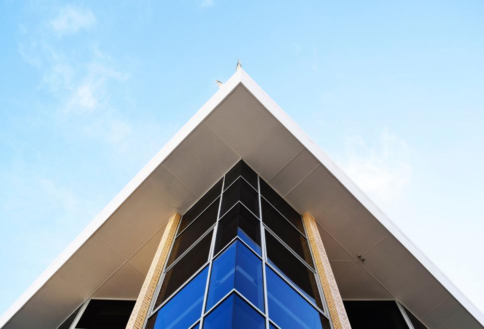 Free Image of Tall Building With Blue and White Triangle 