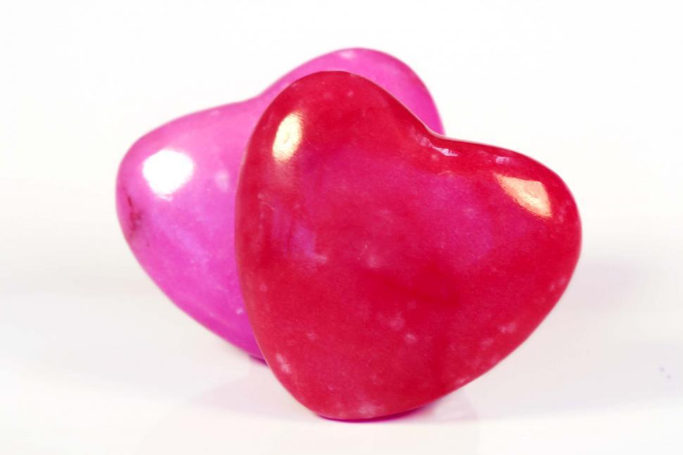 Free Image of Two Pink Hearts Sitting Together 