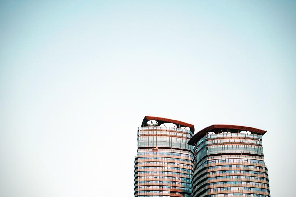 Free Image of Two Tall Buildings Adjacent to Each Other 