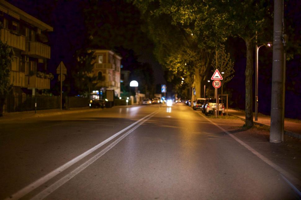 Free Image of City Street Illuminated by Nighttime Street Lights 