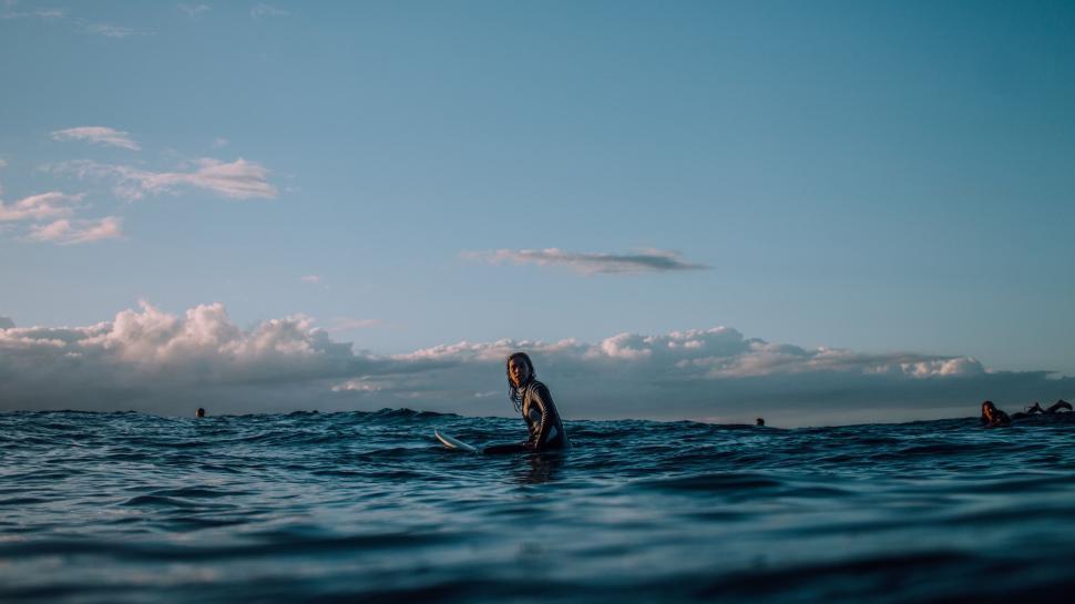 Free Image of Person Standing on Surfboard in Ocean 