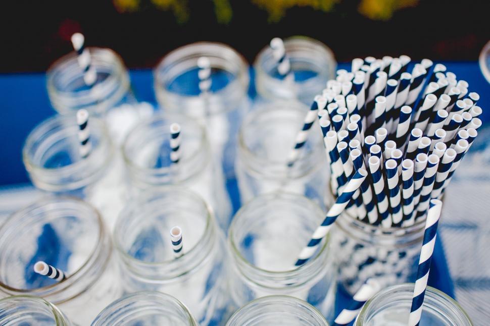 Free Image of Table Filled With Glasses of Drinking Straws 