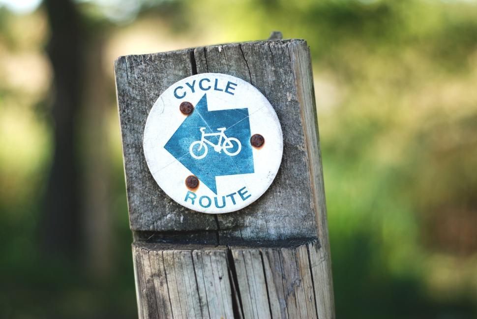 Free Image of Bicycle Route Sign on Wooden Post 