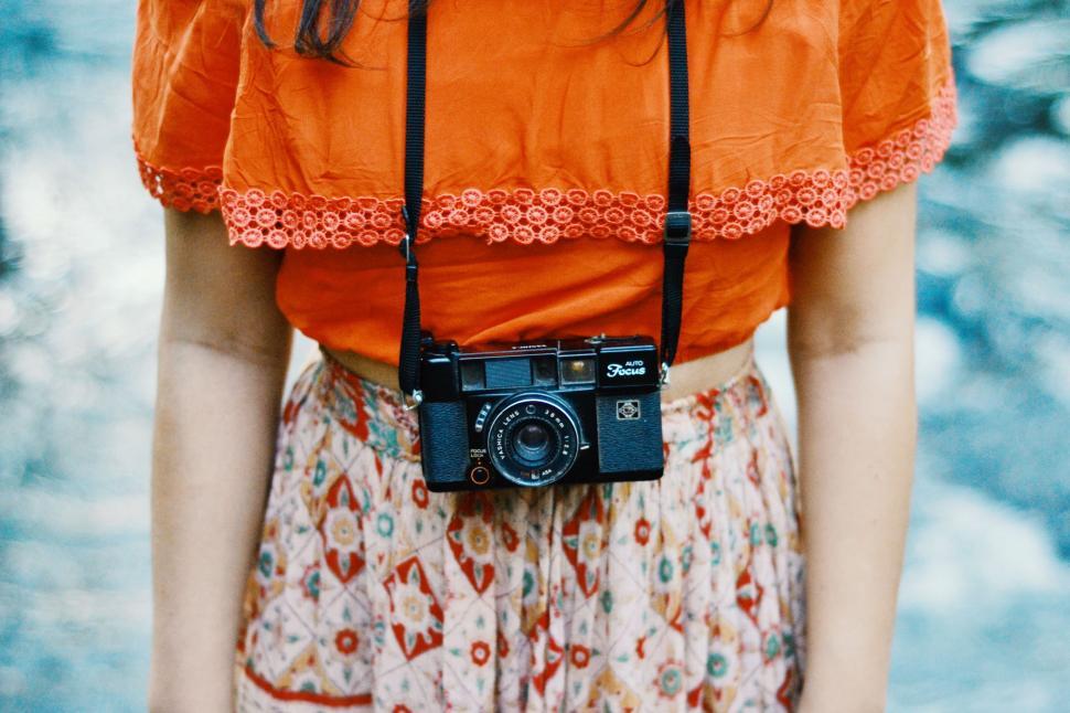 Free Image of Woman Holding Camera 
