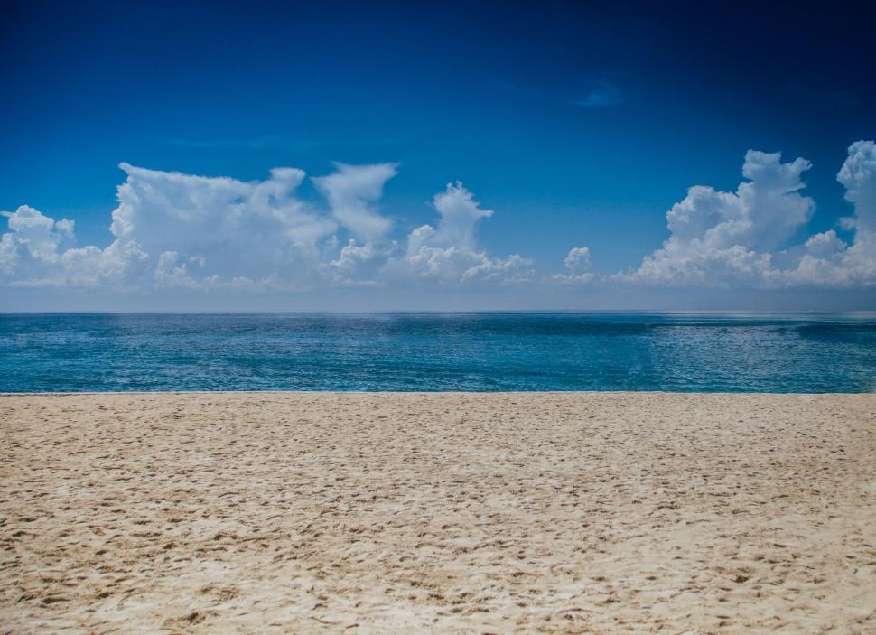 Free Image of Sandy Beach With Blue Ocean 