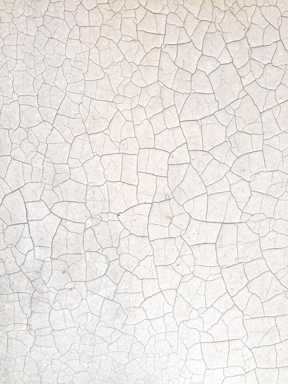 Free Image of A White Wall With Cracks 