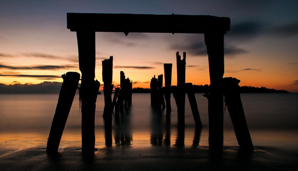 Free Image of Wooden Structure on Beach Near Ocean 
