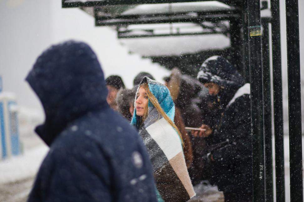 Free Image of People Boarding Bus in Snow 