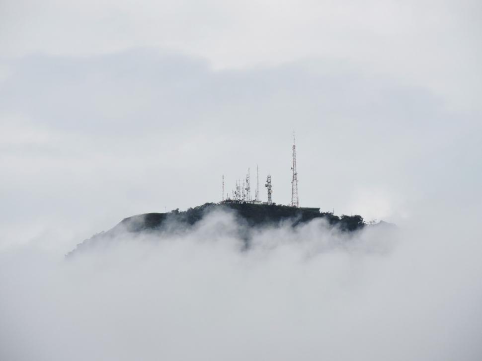 Free Image of Foggy Mountain With Distant Radio Tower 