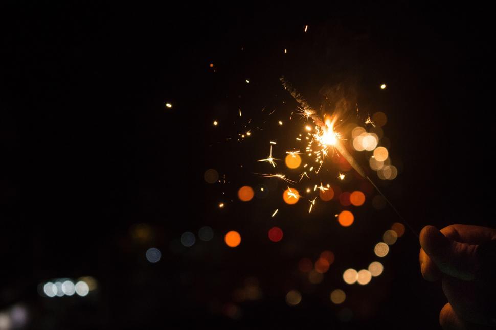 Free Image of Person Holding Sparkler in the Dark 