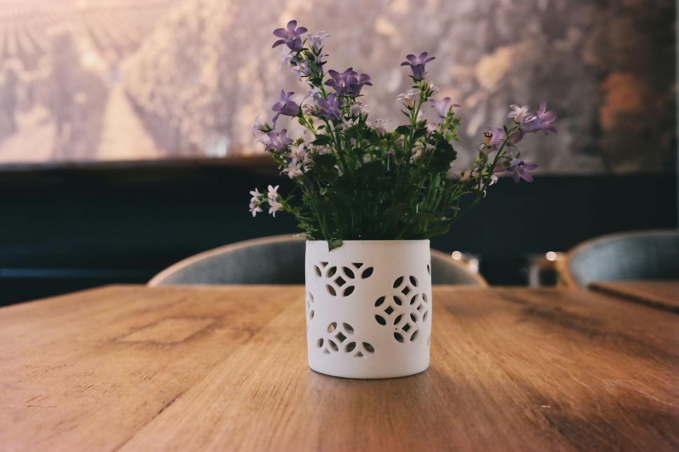 Free Image of Wooden Table With White Vase and Flowers 