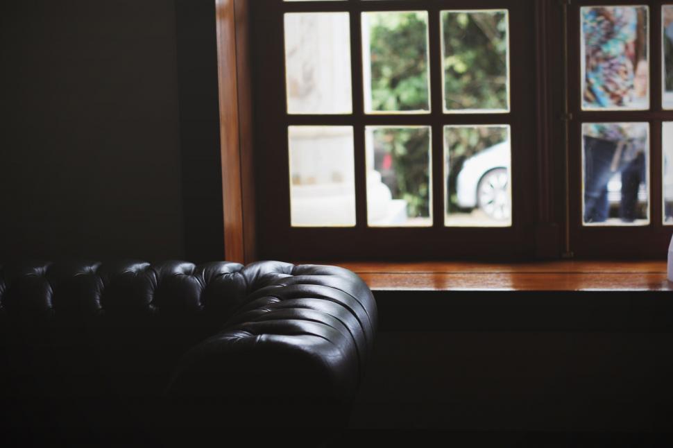 Free Image of Black Leather Chair by Window 