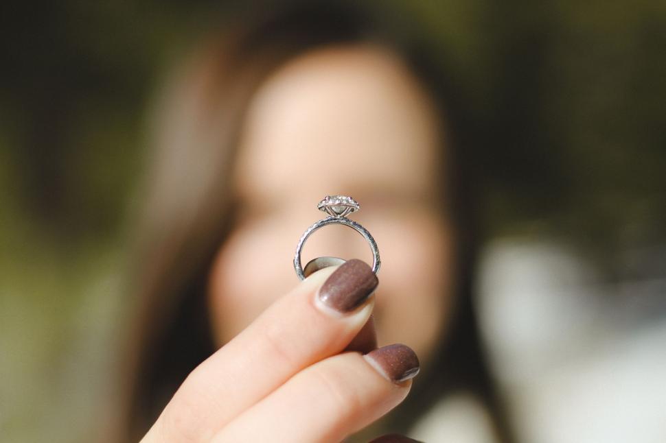 Free Image of Woman Holding Ring in Hand 