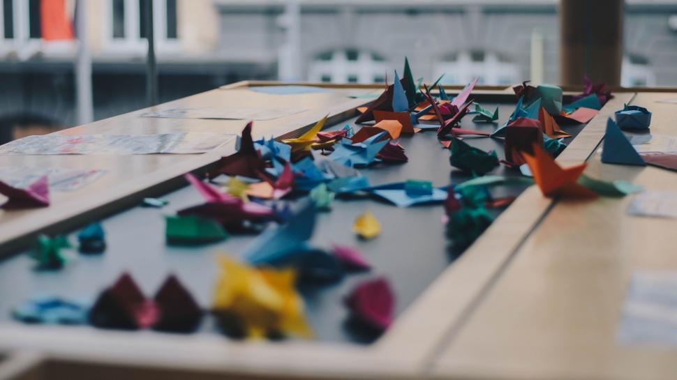 Free Image of Group of Origami Birds on Table 