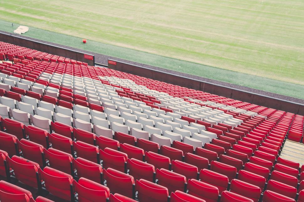 Free Image of A Stadium Filled With Red Seats 