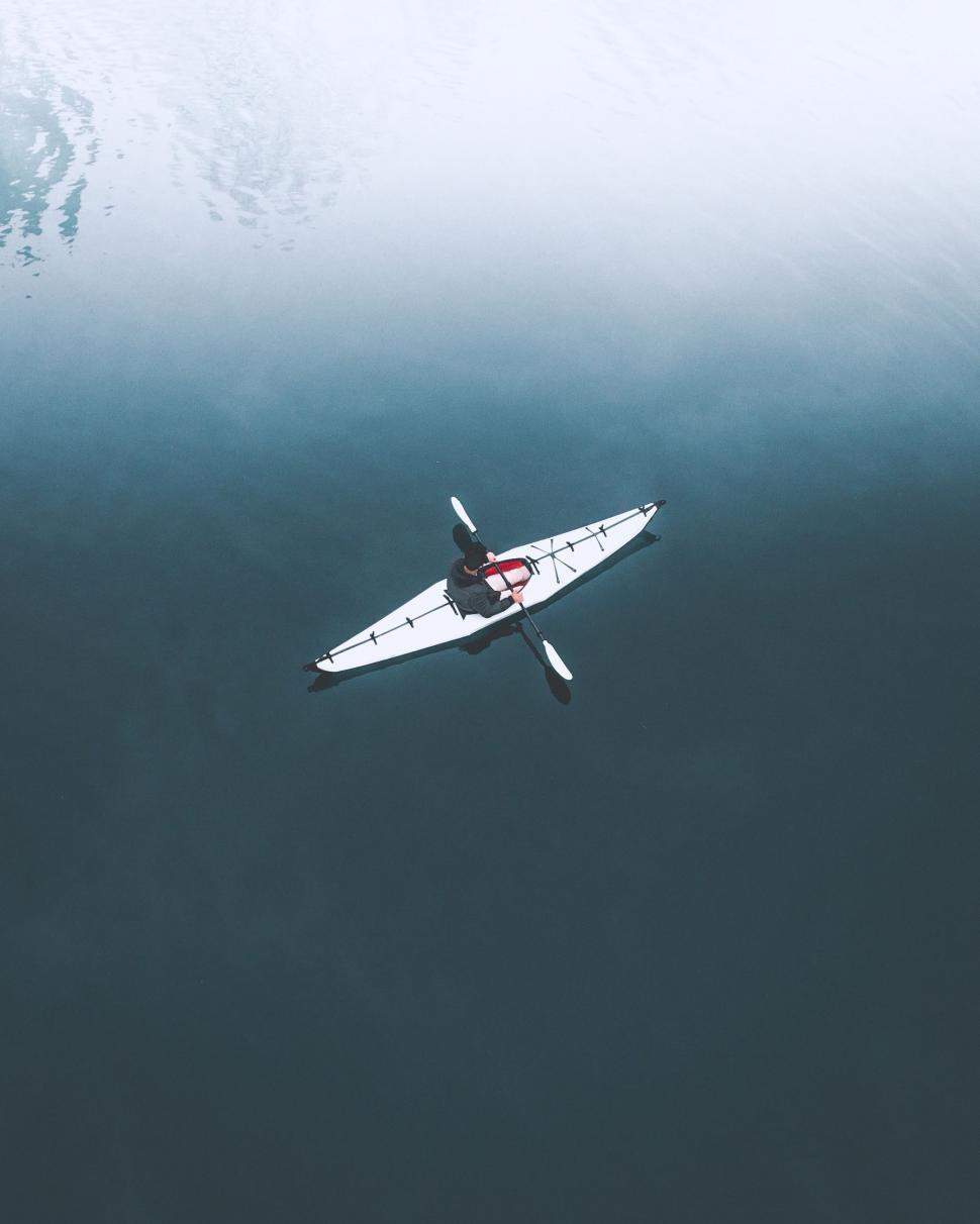Free Image of Person Kayaking in the Middle of the Ocean 