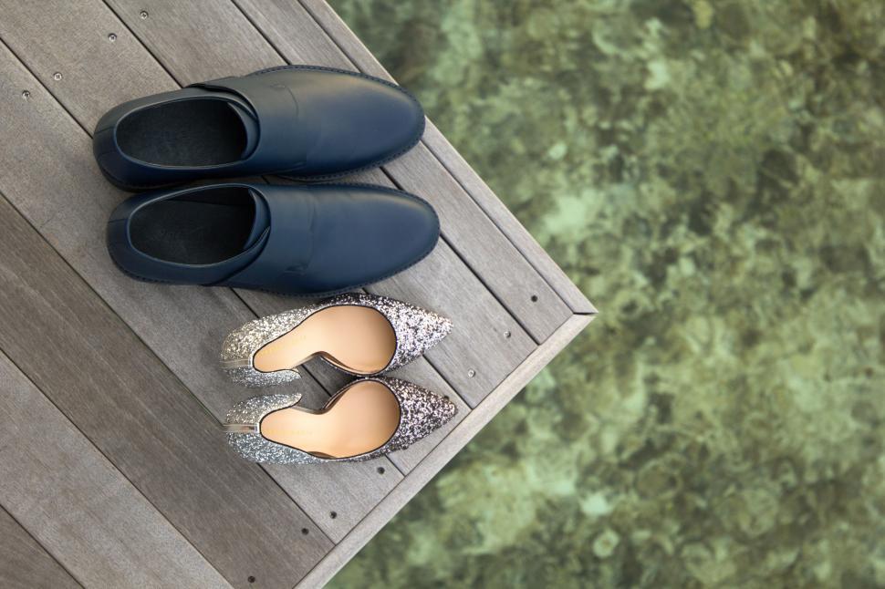 Free Image of Pair of Shoes on Wooden Floor 