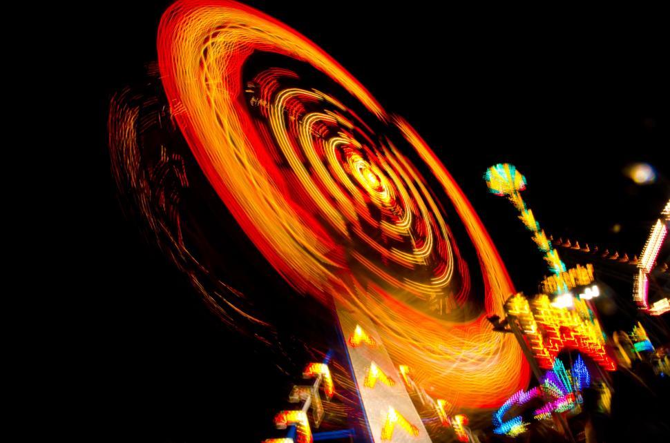 Free Image of Vibrant Carnival Ride Lighting Up the Night Sky 