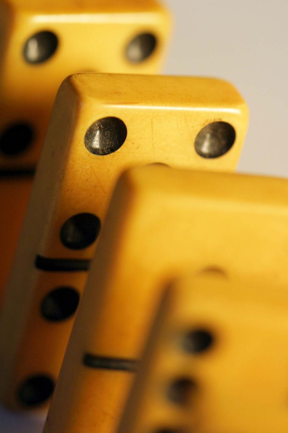Free Image of Group of Yellow Dominoes Stacked Together 