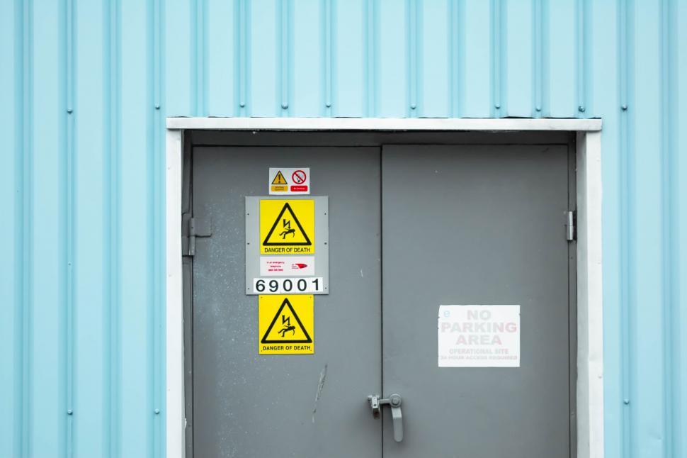 Free Image of Metal Door With Warning Signs 