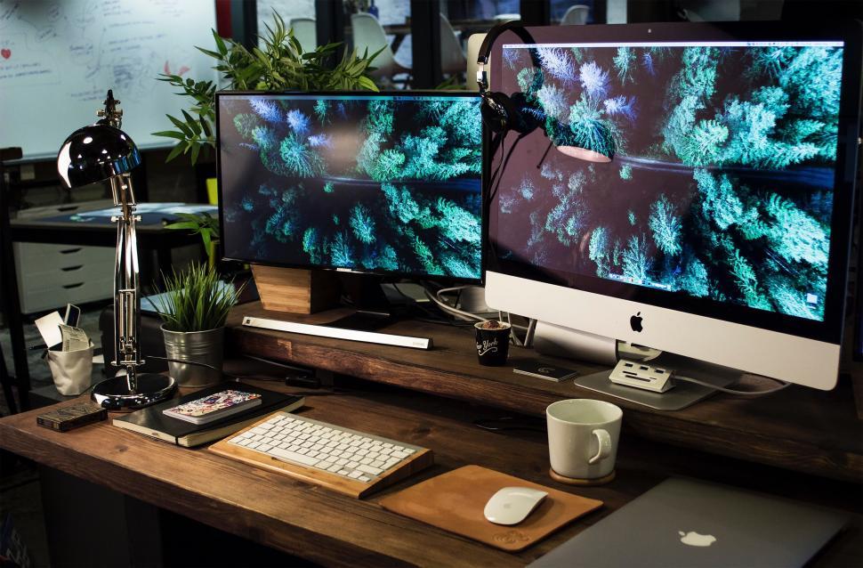 Free Image of Two Computer Monitors on Wooden Desk 