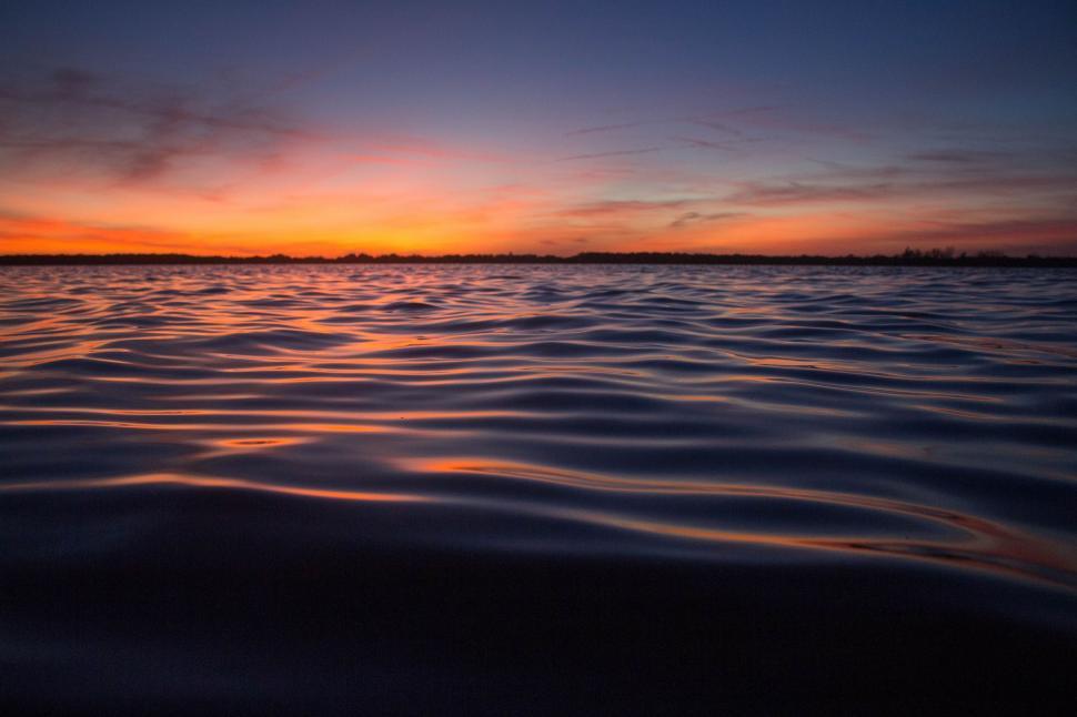 Free Image of Sunset Over a Body of Water 