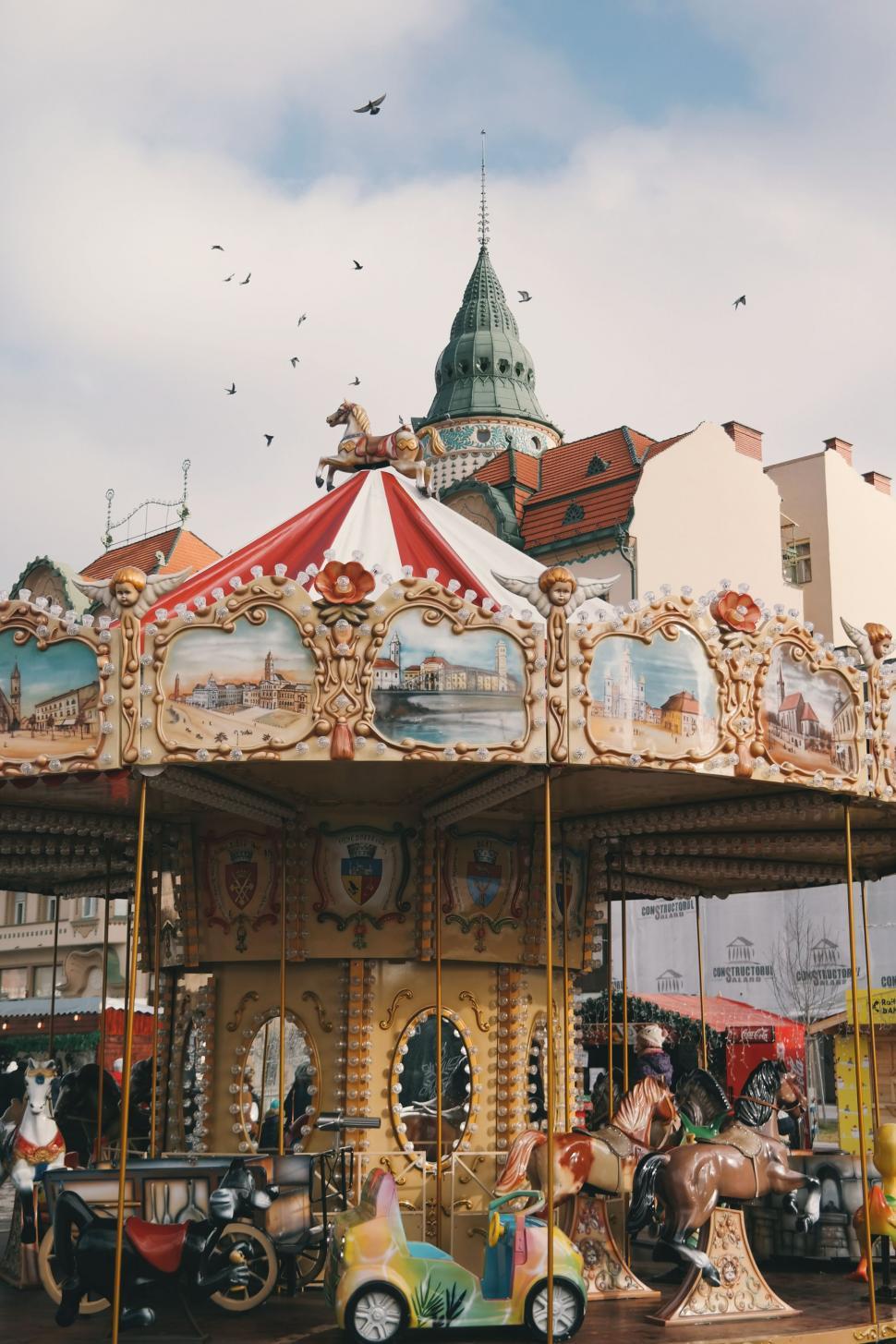Free Image of Carousel With Horses and Carriages 