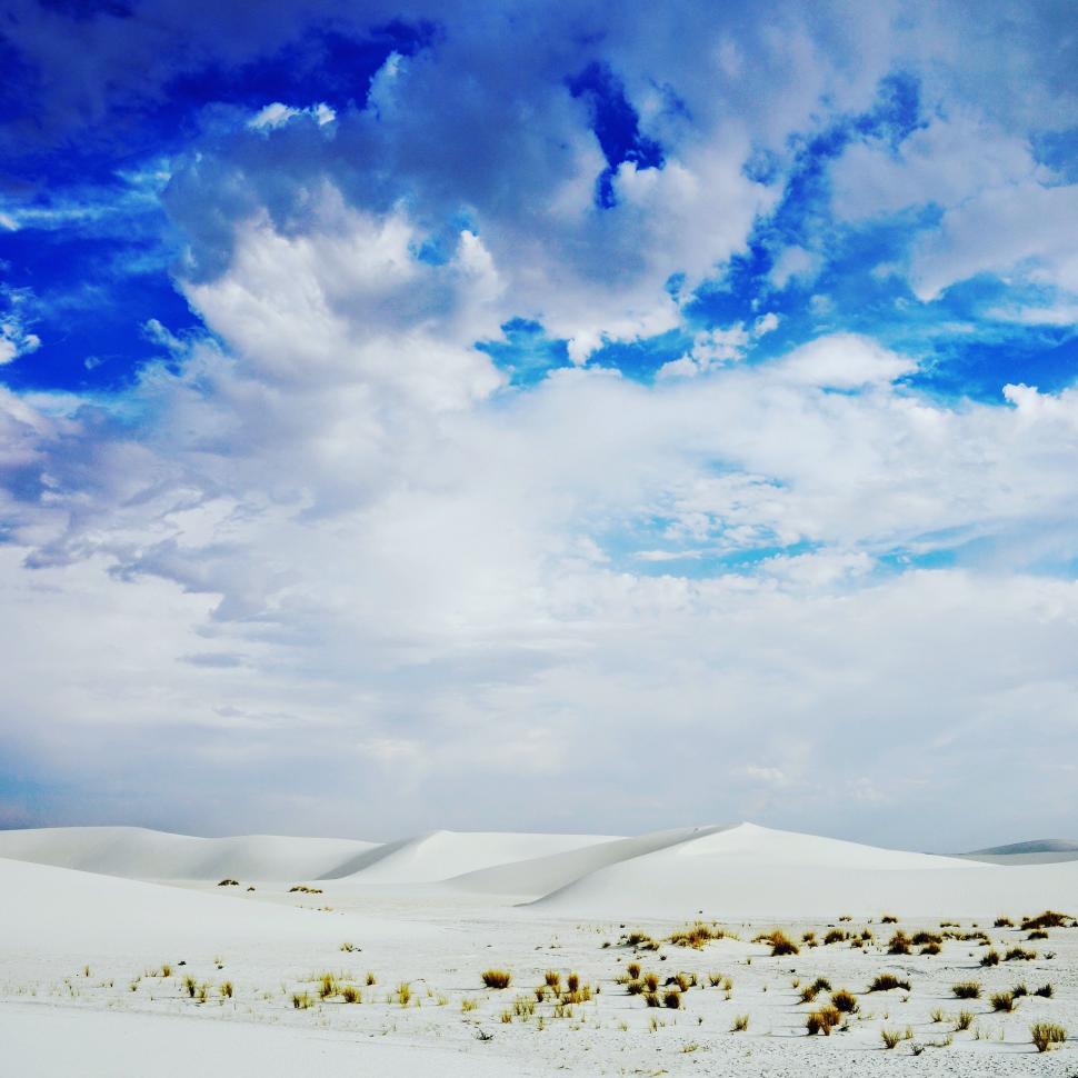 Free Image of White Sand Desert Landscape Under Blue Sky 