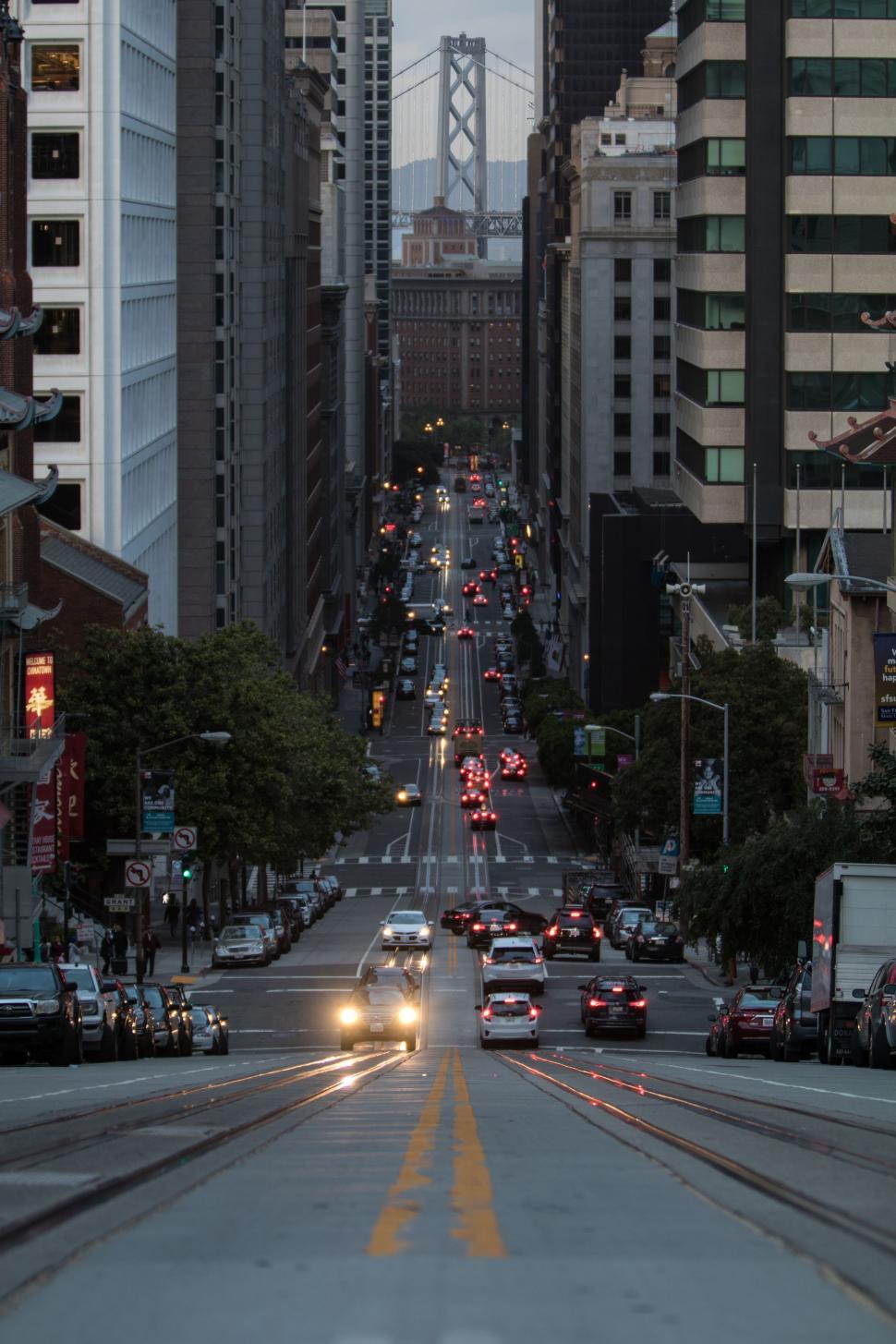 Free Image of Bustling City Street With Heavy Traffic and Tall Buildings 