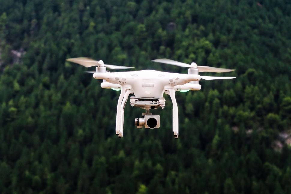 Free Image of White DJI Drone Flying in the Sky 