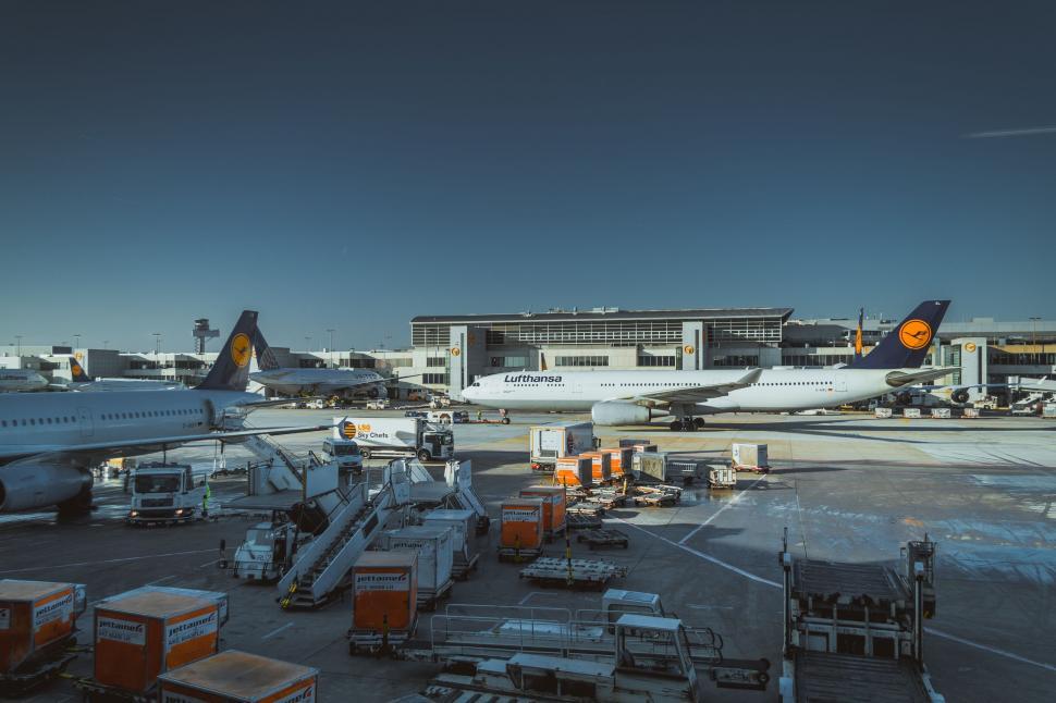 Free Image of Busy Airport Tarmac Filled With Parked Planes 