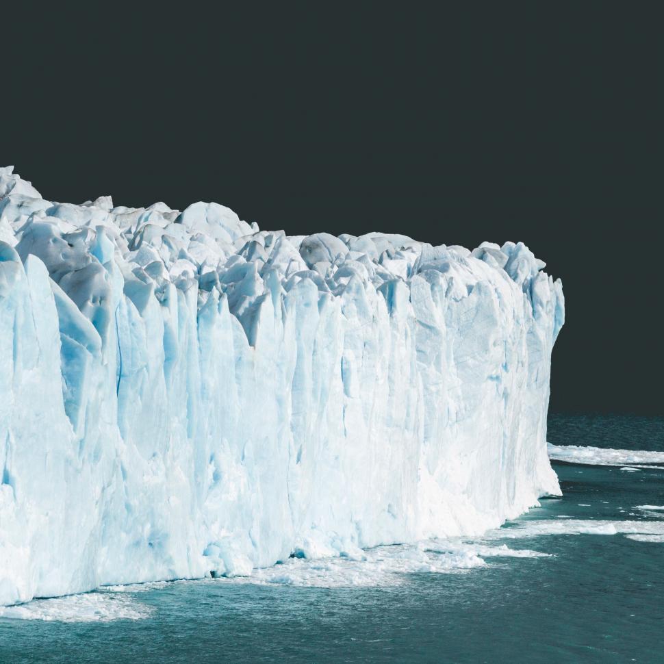 Free Image of Large Iceberg Floating in the Middle of the Ocean 