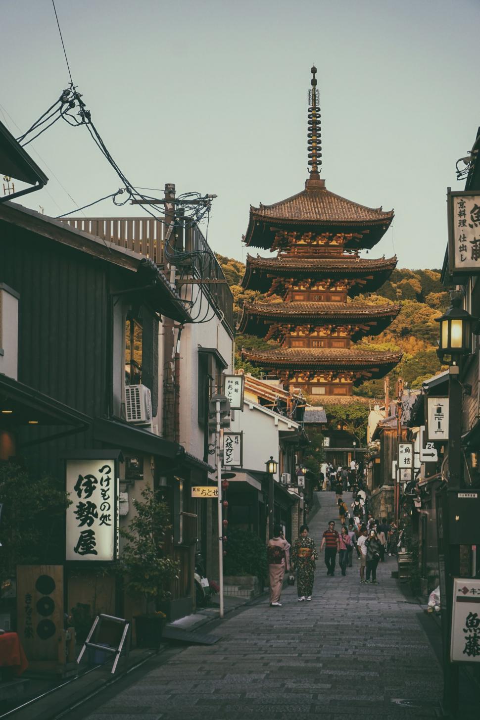Free Image of Narrow Street With Pagoda in Background 