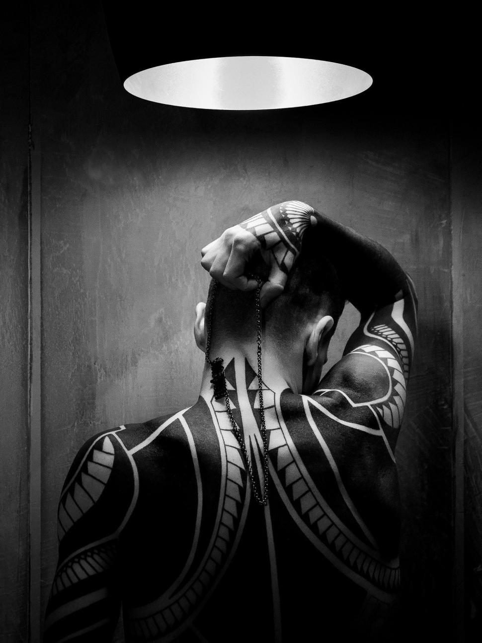 Free Image of Person Covering Face in Black and White 