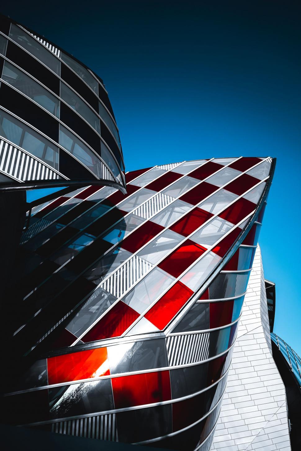 Free Image of Red and White Checkered Design on Side of Building 