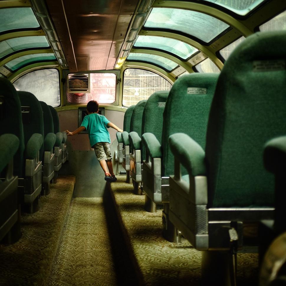 Free Image of Man Standing in Train Aisle 